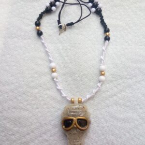 Rebel Sage Skull Pendent with Macrame Necklace, Golden Sunglasses and Beads – unisex bold fashion accessory.